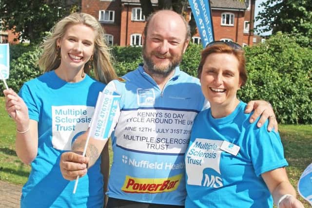 Kenny Smith back in Chichester after 50-day cycle around UK. with MS Trust fundraisers Lydia Parkin, left and Kelly Boston. Photo by Derek Martin Photography. DM1975656a.